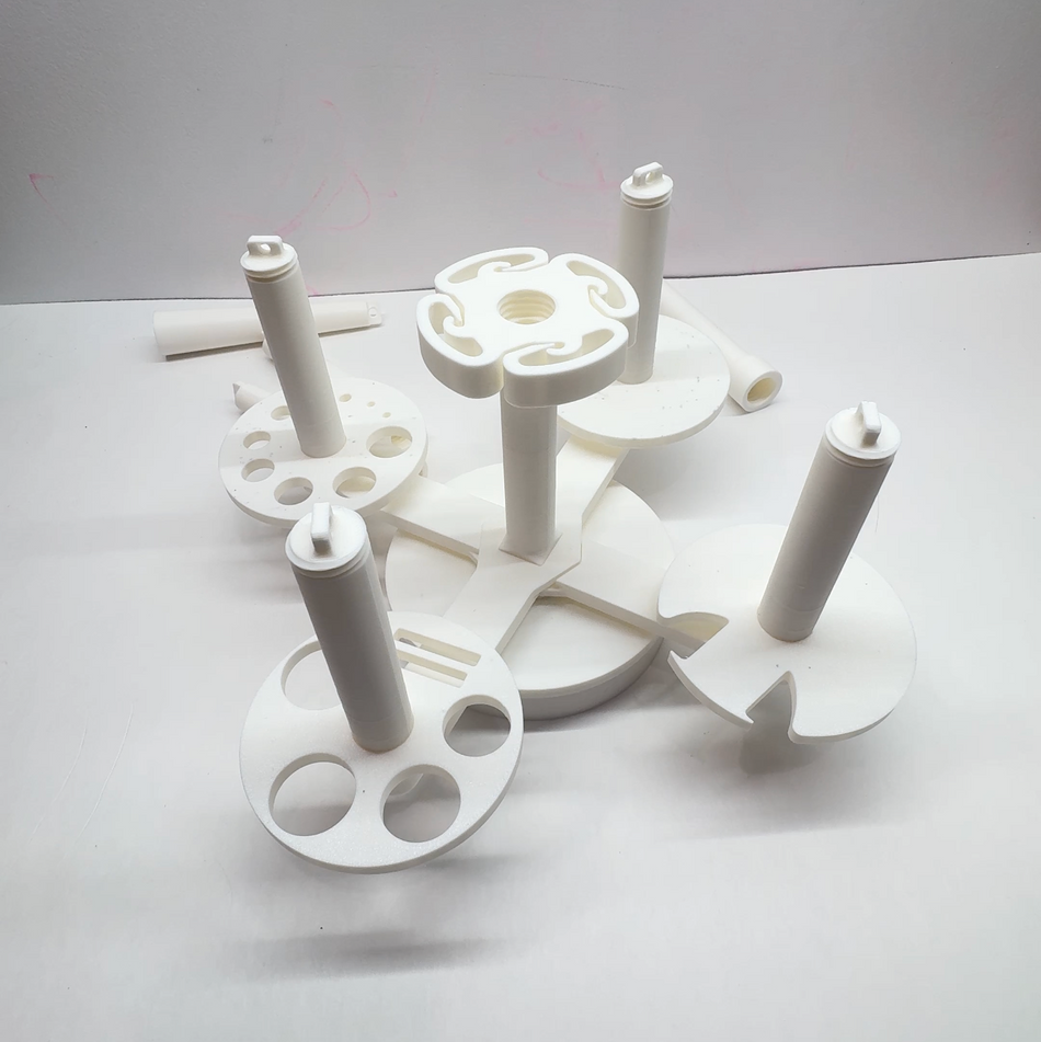 Multi Yarn Spinner 2.0 holding four yarn cakes side by side for crochet and knitting projects