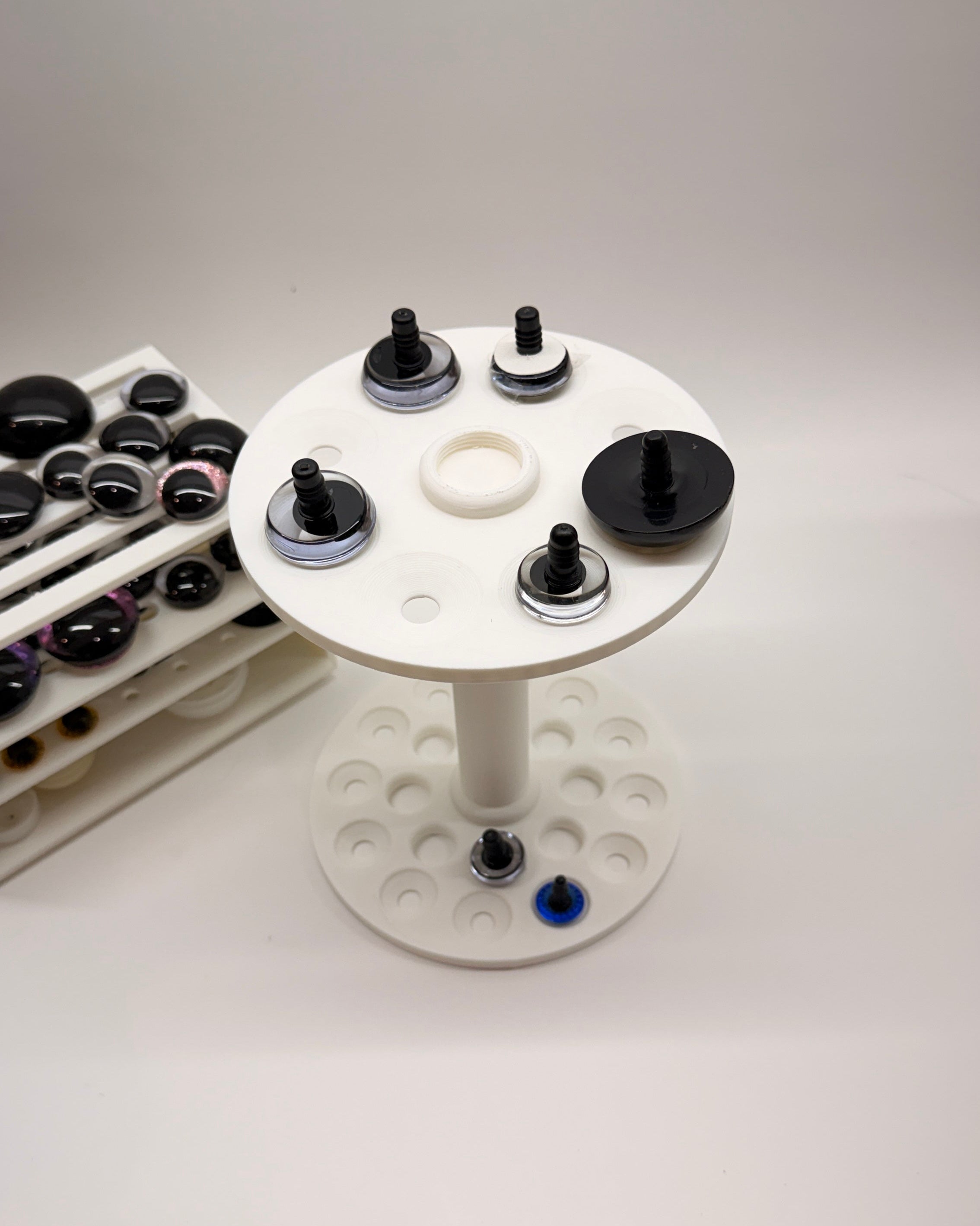 Safety Eye Painter tool for crochet and amigurumi projects, holds 10mm to 40mm safety eyes for painting and drying.